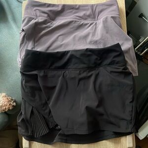 Lululemon women’s play off the pleat tennis skirts size 4 (1 black, 1 purple)